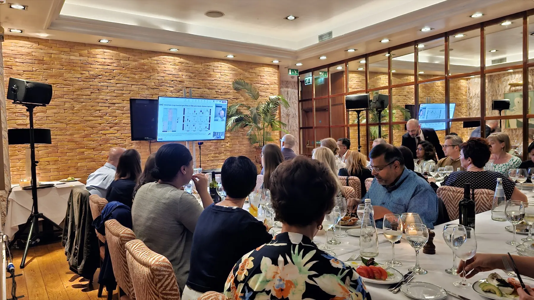 Corporate event production with presentation screens and professional sound