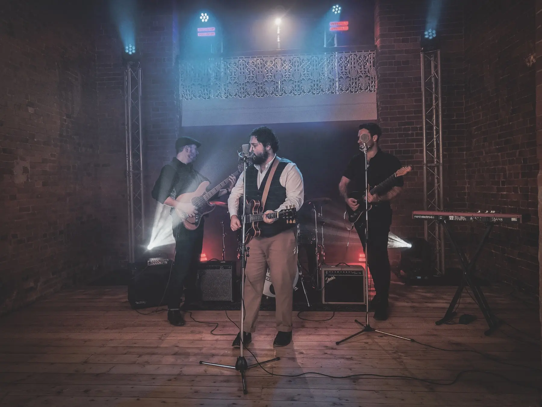 Live band performing with professional Show Pro stage lighting and audio